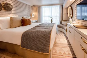 Prestige каюта с балконом на Le Dumont D'urville